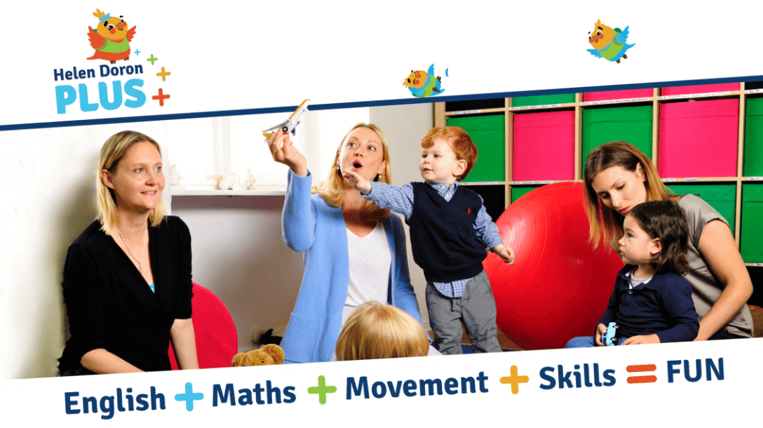 a group of teachers and toddlers standing and playing around each other